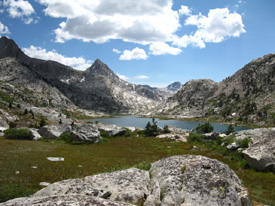 Mount Spencer and Huxley in foreground before Saphire Lake. Peak 12960 in far background.